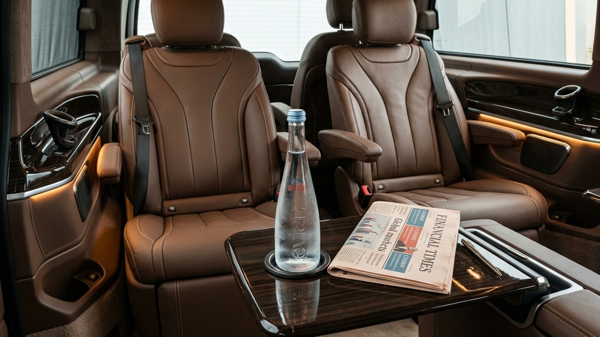 Chauffeur opening door of executive Mercedes for passenger during hourly disposal service in Paris